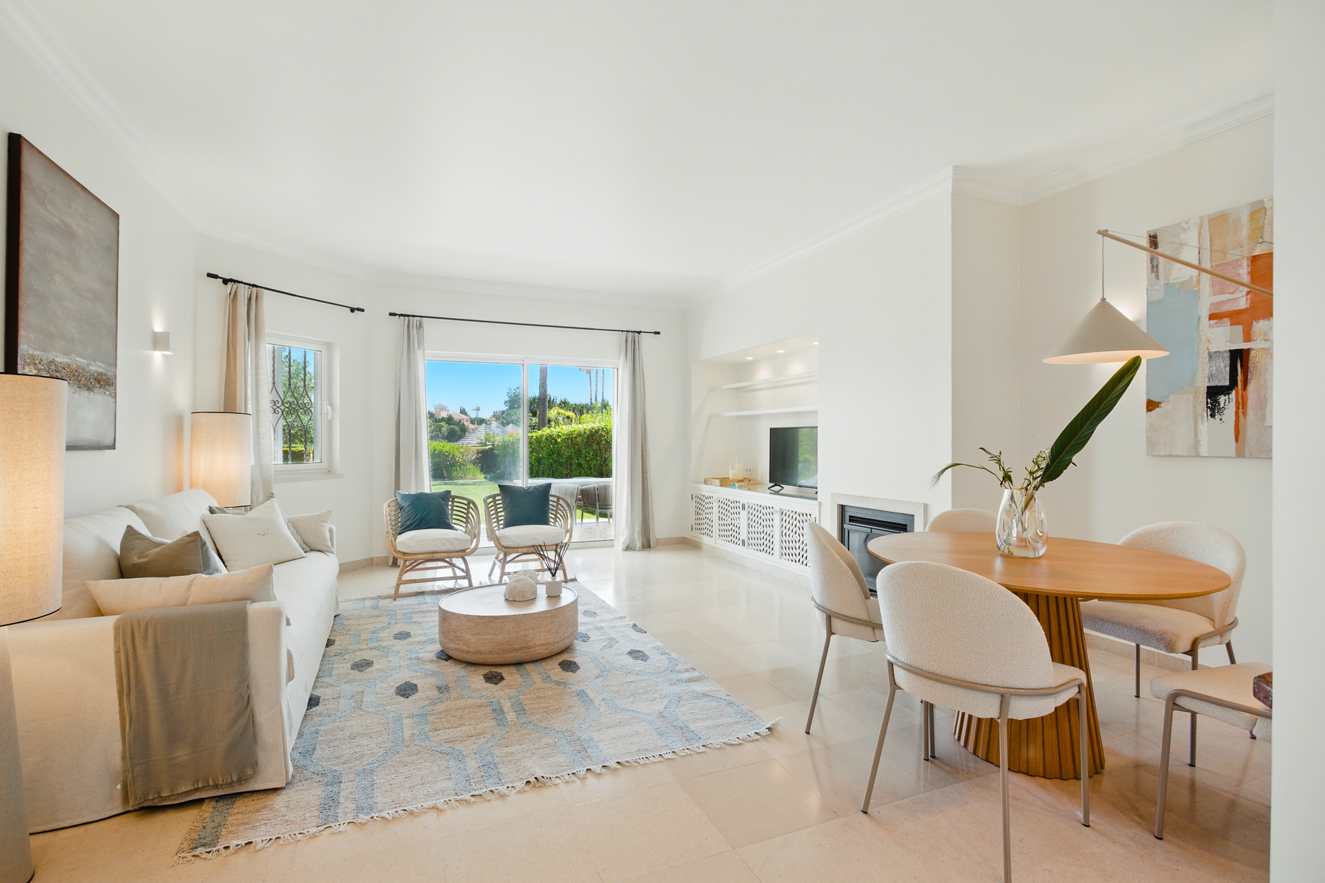 Portugal Capital Gains Tax context with a bright, elegant living and dining interior in a Portuguese property.